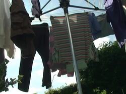 Green clothes drying Stock Footage