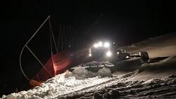 Machine for leveling the ski slopes works at night. Stock Footage