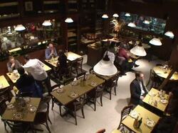 Waiters deliver food to restaurant patrons. Stock Footage