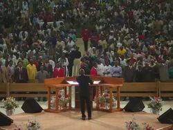 WS Large church interior filling up with people praying, singing and dancing / Lagos, Nigeria Stock Footage