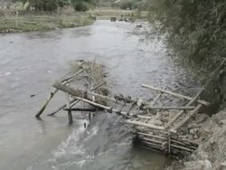 WS small hydroelectric generators in river / Xam Neua, Laos Stock Footage