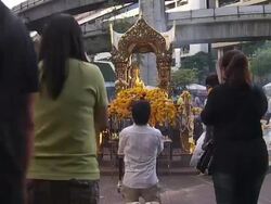 Prayers being said next to Buddhist shrine News Clip