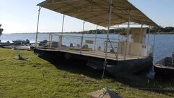 Beware of Crocodiles sign at side of Zambezi News Clip