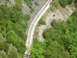   MS AERIAL TS Shot of rack railroad tracks / Kalavryt, Peloponnese, Greece Stock Footage