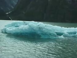 Passing Small Melted Ice Glacier from Boat, Push Stock Footage