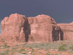 PAN Exotic rock formations in arid terrain at Arches National Park / Utah, United States Stock Footage