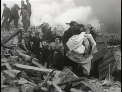 Rescuers save people from the rubble after the biggest air raid on London. News Clip