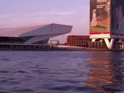 Tracking shot of the EYE contemporary movie culture center from the river IJ Stock Footage