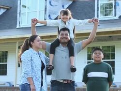 WS DS Portrait of Proud Family in Front of House Under Construction / Eastville, Virginia, United States Stock Footage