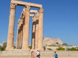 WS View of Athens ruins of famous Temple of Zeus pillars and historical monument landmark with tourist / Athens, Greece Stock Footage