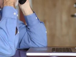 Senior Man Discusses Documents over Phone - CU Stock Footage