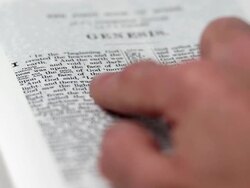 HD Reading Genesis 1 Close-up (Rack Focus) (4:2:2) Stock Footage