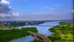 Vehicles travel on a bridge over the Potomac River. Stock Footage