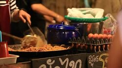 Cooking thai Noodles On A Wok Stock Footage