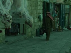 Street with dead sheep hanging outside butcher's shop, Jordan Stock Footage
