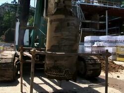 Drilling rig creating a hole in building site Stock Footage