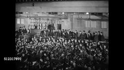 1939: JAPAN STOCK MARKET: HA INT WS Japanese stock brokers stock exchange. LA MS Man shouting hand gesturing numbers. MS Man posting prices signs on board. Tokyo Instructional Video