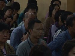 MS PAN Students sitting on ground folding their hands in prayer AUDIO / Dharamsala, Himachal Pradesh, India Stock Footage