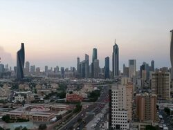 Kuwait, Kuwait City, elevated view over the modern city skyline at dusk Stock Footage