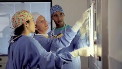 Surgeons reviewing and discussing x-rays Stock Footage
