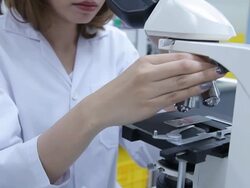 HD : Scientist using microscope Stock Footage