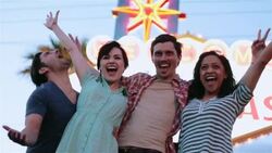 Friends pose for pictures in front of Las Vegas welcome sign Stock Footage
