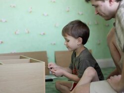 Father and son working together Stock Footage