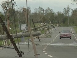 Downed power lines lie on road after Super Typhoon Megi or Juan, NE Luzon, Philippines Oct 2010 / AUDIO Stock Footage