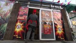 He Wei employees bring boxes of fireworks into their store in Beijing. Stock Footage