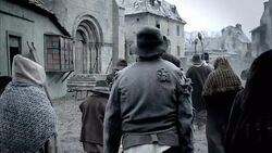 Villagers amble through a smoking village during the Black Plague. Stock Footage