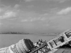 Cotton bales loaded onto ship during the Great Depression Stock Footage