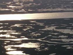 Aerial wide shot pan sun setting over watery landscape / Louisiana Stock Footage
