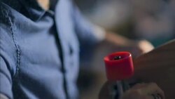 Young shop worker mounts axle on skateboard with screwdriver and socket wrench Stock Footage
