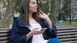 Young girl texting on smart phone Stock Footage