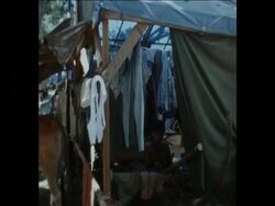 SYND 22-9-73 REFUGEE CAMP AND FOOD QUEUES IN PHNOM PENH News Clip