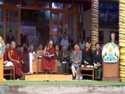 WS Dalai Lama peruses through gift book on stage among various guests at his birthday celebration AUDIO / Dharmasala, Himachal Pradesh, India Stock Footage