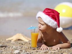 Baby Santa Claus on the beach Stock Footage