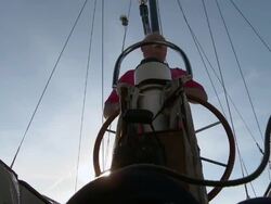 MS Older man sailing into harbour getting ready to tie boat to dock / Wismar, Mecklenburg-Vorpommern, Germany  Stock Footage