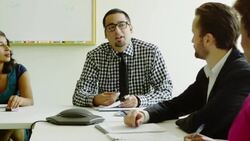 MS Coworkers in discussion at conference room table Stock Footage