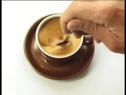 Stirring an at-sign Stock Footage