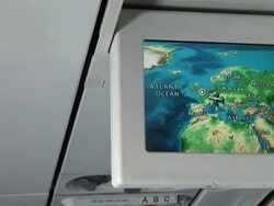 Airplane monitor showing different map views of the travel Stock Footage