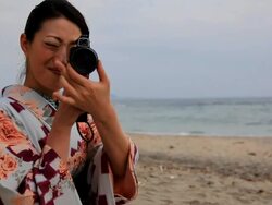 Japanese woman filming with 8mm camera Stock Footage