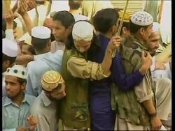 Relief supplies + detained aid worker's family + protest News Clip