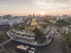 Asia, Myanmar, Yangon, elevated view of skyline and Sule Pagoda, in middle of road intersection Stock Footage