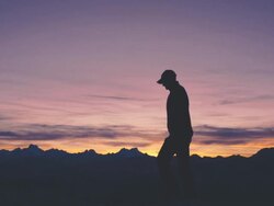 Walking on Mountain Top at Sunset Stock Footage