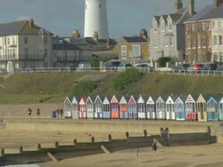 Southwold,colourful beach huts,Lighthouse,MS Stock Footage