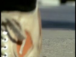 MS Low angle, Vapourer moth walking along pavement, narrowly avoided by peoples feet, England Stock Footage