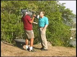 TV News Cameraman with Reporter/Producer Stock Footage