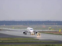 Airplane taxied on runway, tractor and control car Stock Footage
