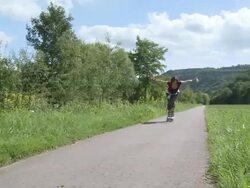 WS PAN Woman in-line skating / Saarburg, Saar-Valley, Rhineland-Palatinate, Germany Stock Footage